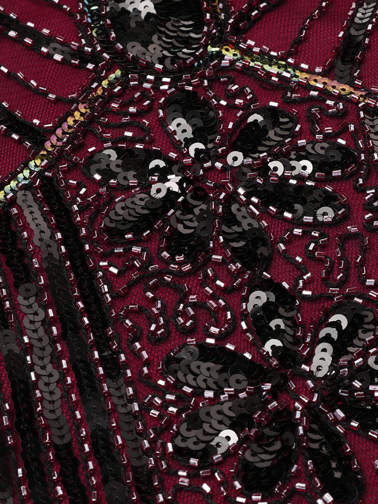 This 1920s Sequined Fringe Dress wraps her in 1920s elegance, one twirl at a time