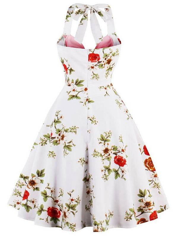 She wears 1950s Halter Floral Swing Dress with vintage grace