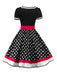 She wears 1950s Polka Dot Belted Patchwork Dress with vintage grace