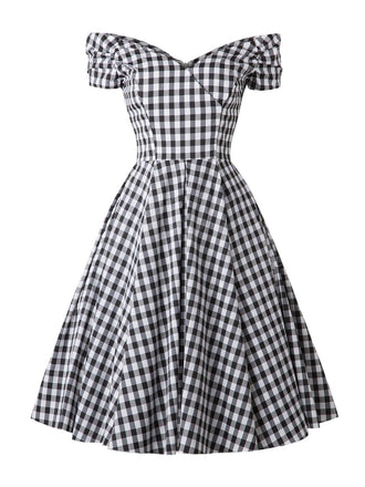 She slips into this Black 1950s Plaid Swing Dress and suddenly it's a 1950s daydream